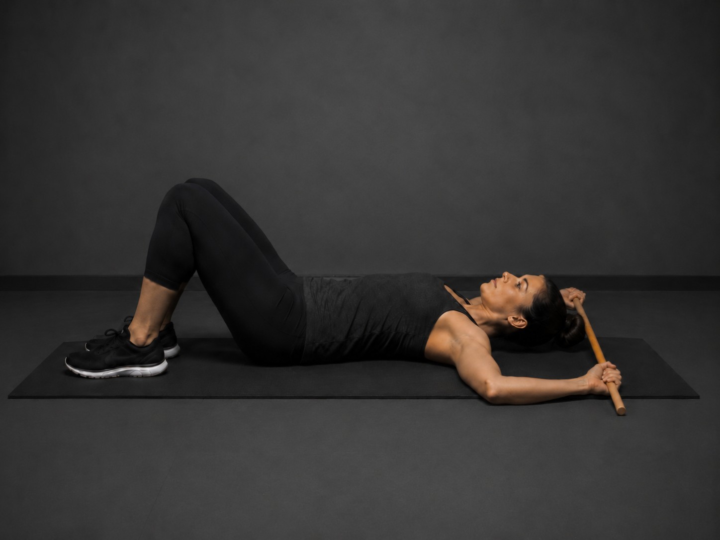 Supine shoulder external rotation with stick — exercise demonstration